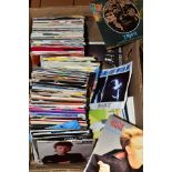 A TRAY CONTAINING OVER TWO HUNDRED 7'' SINGLES from the 1980's, 70's and 60's
