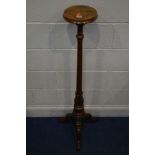 AN EARLY 20TH CENTURY WALNUT AND ROSEWOOD TRIPOD TOCHERE STAND, on a fluted and acanthus support,