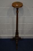 AN EARLY 20TH CENTURY WALNUT AND ROSEWOOD TRIPOD TOCHERE STAND, on a fluted and acanthus support,