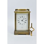 A BRASS STRIKING CARRIAGE CLOCK, dial signed W. Angus Paris, 17 Lord Street, Liverpool, Roman