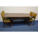 AN EARLY TO MID 20TH CENTURY OAK DRAWER LEAF TABLE, on large twin acorn supports, united by a