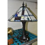 A MODERN TIFFANY STYLE TABLE LAMP, rectangular shade with chamfered corners, height approximately