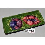 A MOORCROFT POTTERY RECTANGULAR PIN/PEN TRAY, 'Anemone' pattern on green ground, impressed