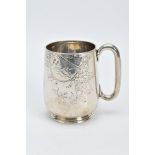 A VICTORIAN SILVER MUG, with a floral and foliate engraved design body, plain polished handle, on