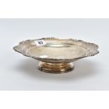 A SILVER MAPPIN AND WEBB DISH, of a circular form with a shell decorated wavy edge, on a raised