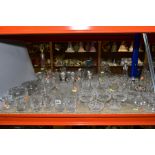 A GROUP OF CUT AND ETCHED GLASSWARE, including two decanters with stoppers, grapefruit dishes,