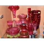 A SMALL GROUP OF CRANBERRY AND RUBY COLOURED GLASSWARE, mostly late 19th Century, some damage,