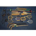 A COLLECTION OF VINTAGE SPORTS EQUIPMENT, to include seven hickory golf clubs, six badminton