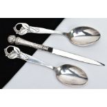TWO SPOONS AND A SILVER PAPER KNIFE, each spoon with an openwork floral designed handle, stamped