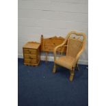 A PINE THREE DRAWER BEDSIDE CABINET, together with a single headboard and a wicker open armchair (