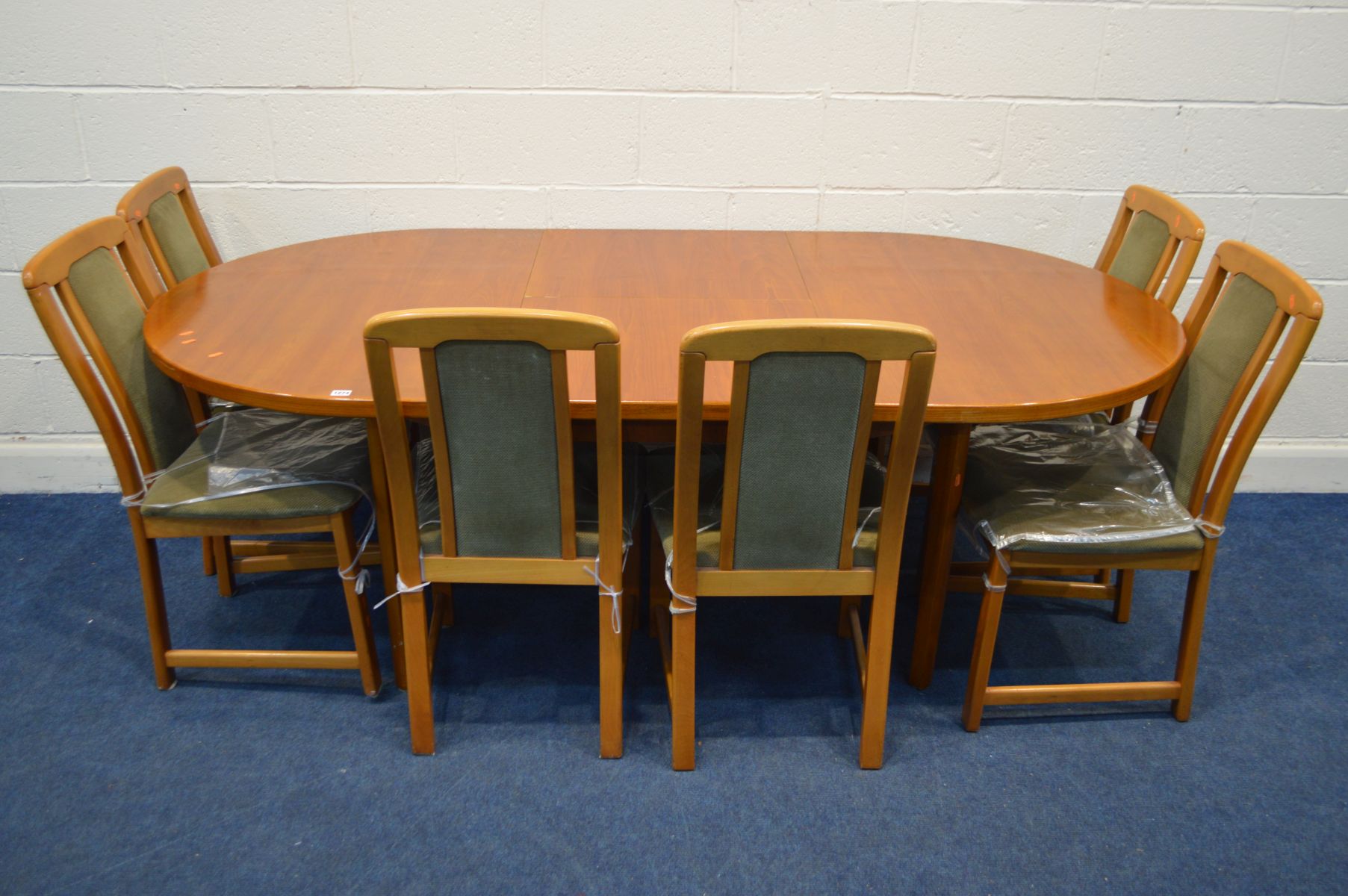 A 1980'S TEAK EXTENDING DINING TABLE, with one additional leaf, extended length 211cm x closed 151cm