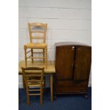 AN EARLY 20TH CENTURY OAK TWO DOOR TALL BOY, with two drawers, width 76cm x depth 44cm x height