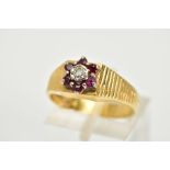 AN 18CT GOLD RUBY AND DIAMOND CLUSTER RING, the tiered cluster set with a central round brilliant