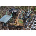 A COLLECTION OF VARIOUS GARDEN TOOLS, to include two metal wheelbarrows, a bundle of various sized