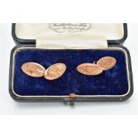 A PAIR OF 9CT GOLD EDWARDIAN CUFFLINKS, each of an oval form with a foliate engraved design,
