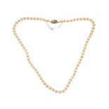 STRING OF MAJORICA FAUX PEARLS WITH A PEARL SET PIERCED SILVER GILT CLASP AND SAFETY CHAIN