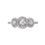 18CT WHITE GOLD THREE STONE DIAMOND HALO RING