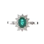 18CT WHITE GOLD EMERALD AND DIAMOND RING