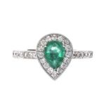 18CT WHITE GOLD EMERALD AND DIAMOND HALO CLUSTER RING