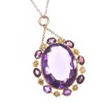 15CT GOLD AMETHYST AND SEEL PEARL PENDANT ON 9CT GOLD CHAIN