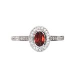 18CT WHITE GOLD GARNET AND DIAMOND RING