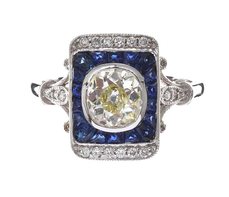 18CT WHITE GOLD SAPPHIRE AND DIAMOND CALIBRE RING