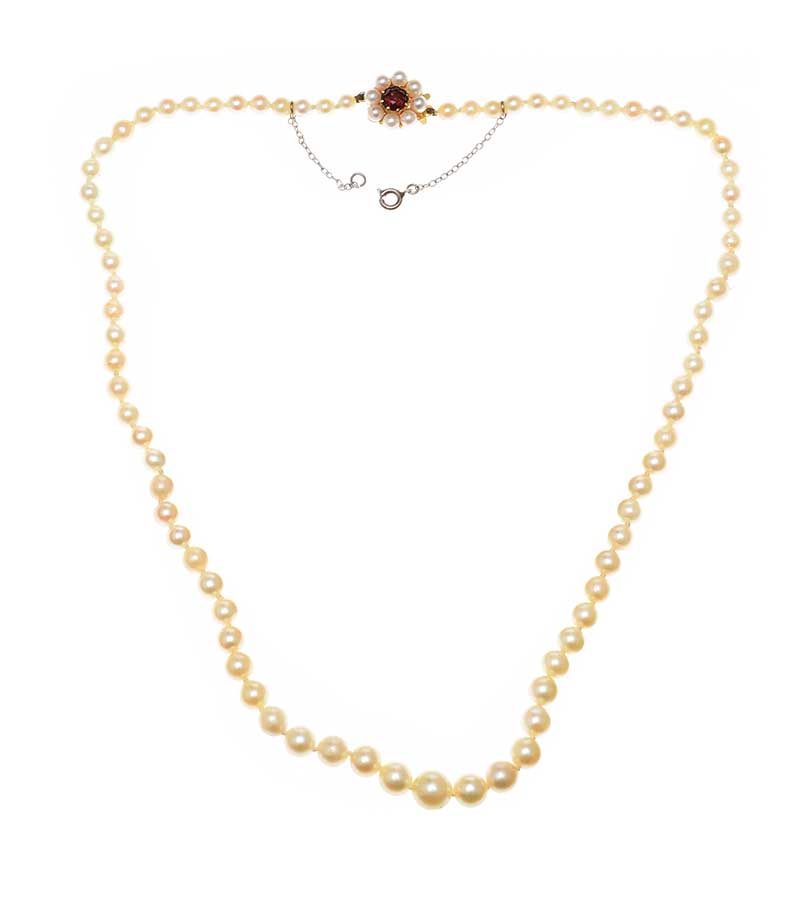 STRAND OF CULTURED PEARLS WITH 9CT GOLD GARNET AND PEARL CLASP