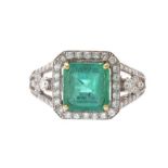 18CT WHITE GOLD EMERALD AND DIAMOND CLUSTER RING