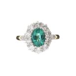 18CT GOLD EMERALD AND DIAMOND CLUSTER RING