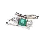 18CT WHITE GOLD EMERALD AND DIAMOND CROSSOVER RING