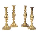 SET OF FOUR BRASS CANDLESTICKS