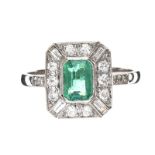 PLATINUM EMERALD AND DIAMOND RING IN THE STYLE OF ART DECO