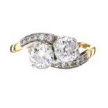 18CT GOLD TWO STONE DIAMOND TWIST RING