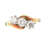 18CT GOLD DIAMOND THREE STONE CROSSOVER RING