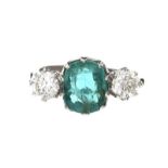 PLATINUM EMERALD AND DIAMOND THREE STONE RING