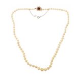 STRAND OF CULTURED PEARLS WITH 9CT GOLD GARNET AND PEARL CLASP