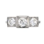 PLATINUM DIAMOND THREE STONE RING IN THE STYLE OF ART DECO