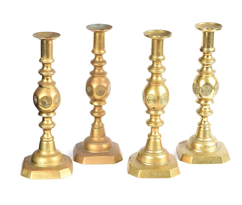 SET OF FOUR BRASS CANDLESTICKS