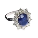 18CT WHITE GOLD SAPPHIRE AND DIAMOND CLUSTER RING