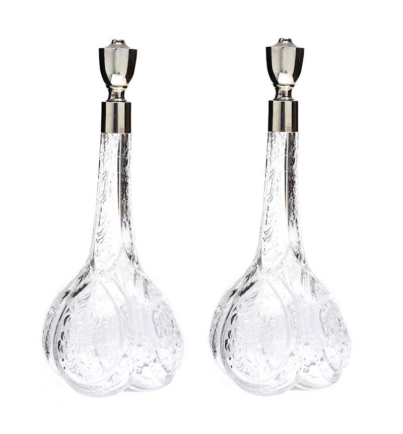 PAIR OF SILVER MOUNTED CUT-GLASS DECANTERS