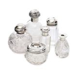 FIVE SLVER TOPPED GLASS BOTTLES AND A HAIR PIN TIDY