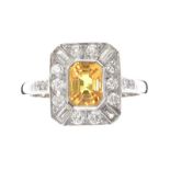 PLATINUM YELLOW SAPPHIRE AND DIAMOND RING IN THE STYLE OF ART DECO