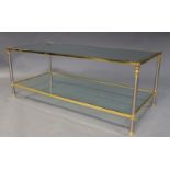 A brass and brushed steel two tier coffee table, c.1980, the rectangular glass top on brass and