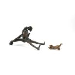 Erotic couple, a bronze figure group of a woman astride a man, 23cm wide , together with a bronze