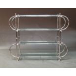 An architectural tubular chromed etagere, c.1980, with four glass shelves, 128cm high, 170cm wide,