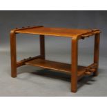 A French cherry wood two tier side table, c.1940, the rectangular top with decorative pegged ends,