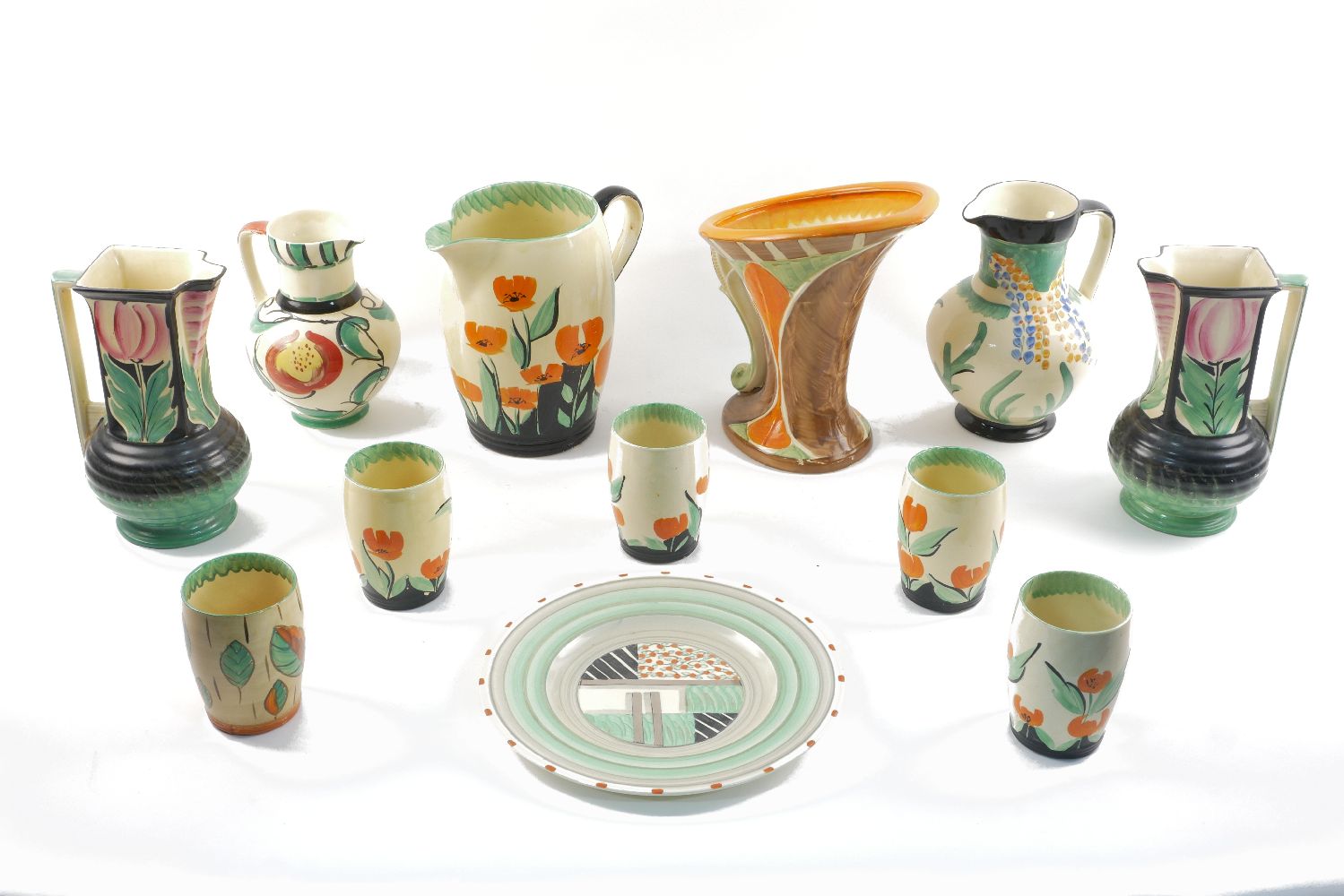 A Myott lemonade set, 20th century, decorated with orange tulips, the jug 21.5cm high, the 5 cups
