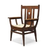 Arts & Crafts, an oak throne chair early 20th Century With slatted backrest, the central splat
