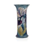 William Moorcroft (1872-1945), a Purple Iris pattern ceramic vase with flared neck c.1916, signed in