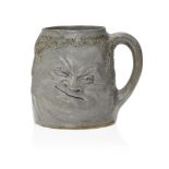 R.W. Martin (1843-1923), a Martin Brothers stoneware Double ‘Face’ mug c.1890, Signed R.W Martin &